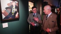 King Charles III is shown a painting of 99-year-old D-Day veteran Jim Glennie CREDIT PA.jpg