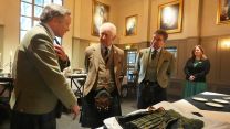 King Charles meets Alexander 'Sandy' Manson (left) as they view a kilt worn by Sandy's grandfather Captain Alexander Manson, during a visit to the Gordon Highlanders Museum CREDIT PA.jpg