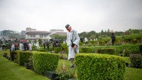 Korea Revisit Veterans UN Cemetery Laying Roses Graves