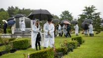 Korea Revisit Veterans UN Cemetery Laying Roses