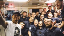 Lewis Hamilton takes a selfie with the crew of HMS Middleton