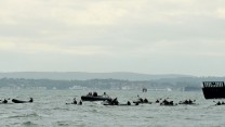 A team of 24 Royal Marines kayakers have arrived in Southsea after an epic paddle from France.