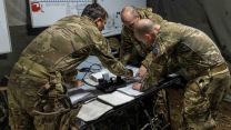 Members of 3 Regt Army Air Corps make plans at Excon 26102022 CREDIT MOD Crown Copyright.jpg