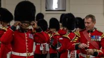 Members of the Household Division make final adjustments to uniform prior to a final dress rehearsal as a part of Operation London Bridge 13092022 CREDIT MOD Crown Copyright.jpg