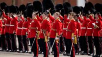 Members of the Irish Guards give three cheers to the Duke and Duchess of Cambridge during their visit to the 1st Battalion Irish Guards for the St Patrick's Day Parade