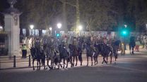Members of the military on the Mall outside Buckingham Palace during a night time rehearsal for the coronation of King Charles 18042023 NO REUSE CREDIT PA WIRE, PA IMAGES.jpg