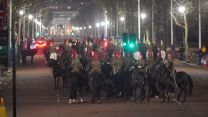 Members of the military on the Mall outside Buckingham Palace during a night time rehearsal for the coronation of the King 18042023 NO REUSE CREDIT PA WIRE, PA IMAGES.jpg