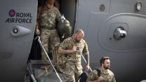 Military personnel departing from a RAF C-17 aircraft after landing at RAF Brize Norton after leaving Afghanistan having helped the UK's evacuation from Kabul airport