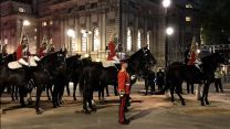 Military personnel take in final preparations for Queen Elizabeth II's funeral during a pre-dawn rehearsal in London.