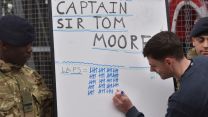Military personnel tick off a tally for laps completed as part of the Captain Tom 100 Challenge (Picture: MOD).