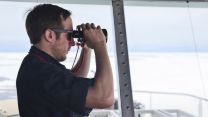 On the lookout during an Arctic expedition with HMS Protector (Picture: Royal Navy).