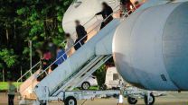 Evacuees disembark from an RAF Voyager