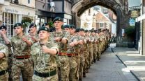 Personnel parade through Salisbury on Armed Forces Day 