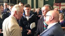 Prince Charles on board HMS Queen Elizabeth meets Falklands War veterans on July 2022.
