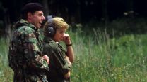 Princess Diana wearing ear defenders during a visit to 13th/18th Royal Hussars in 1988 (Picture: PA Images/Alamy)