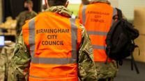 RAF personnel in hi vis jackets as they help with Birmingham's Drop and Collect coronavirus testing initiative (Picture: RAF).