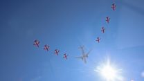 Red Arrows Hawk jets and a Poseidon Maritime Patrol aircraft in a display in the skies over RAF Lossiemouth in Scotland with the sun (Picture: MOD).