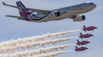 The Red Arrows fly with the RAF's VIP Voyager 