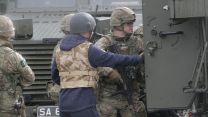 Acting 'dignitary' enters the back of a Foxhound.