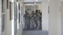 Personnel look for an 'enemy' target.