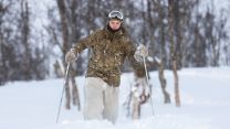 Royal Marine Commando skiing through the trees during the Cold Weather Winter Warfare Course at Malselv