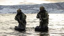 Expert teams from 30 Commando Information Exploitation Group swam ashore and used inflatable raiding boats (Picture: MOD).
