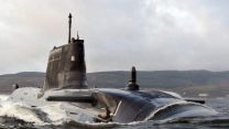 Royal Navy submarine HMS Astute sails up the Clyde estuary into her home port of Faslane, Scotland