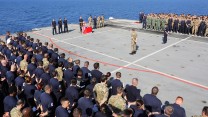 HMS Ocean ships company and NATO partners stand shoulder to shoulder during the Remembrance service onboard HMS Ocean. (Picture: MoD)