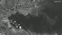 Smoke rising in a satellite image appearing to show Russian convoy moving from its position just outside Kyiv (Picture: Maxar Technologies via REUTERS).