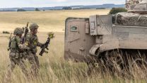 Soldiers mount back up into Warrior vehicles after clearing an enemy position EX IRON CYCLONE 25072023 CREDIT MOD