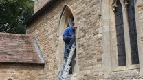 Stained glass, including Red Arrows, which pays tribute to RAF Scampton being installed from outside 160421 CREDIT MOD