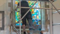 Stained glass, including Red Arrows, which pays tribute to RAF Scampton, being installed with scaffolding 160421 CREDIT MOD