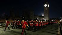 	The Guards Division contingent of the Coronation procession rehearsing in London at night