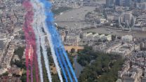 The Red Arrows aerobatic jets flanking an Envoy aircraft of the RAF during the King's Birthday flypast (Picture: MOD).