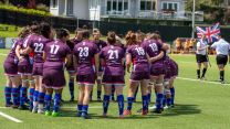 The UKAF players show team unity on the pitch with the British flag flying proudly in the background Credit Alligin Photography