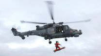 The Winchman of 825 Sqn Wildcat prepares to touch down on flight deck HMS Prince of Wales 31012022 CREDIT NAVY MOD.jpg