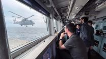 The trials team watch the Merlin come into land on HMS Albion 26072023 CREDIT Royal Navy.jpg
