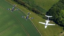Two Texan T1 trainers and a Phenom jet trainer aircraft during QPJ Flypast Rehearsal – RAF College Cranwell 24052022 CREDIT MOD Crown Copyright.jpg