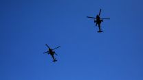 Two helicopters pass overhead as junior soldiers graduate from the AFC Harrogate.
