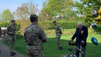 Veteran Captain Tom Moore talkig to 1st Battalion The Yorkshire Regiment soldiers