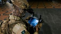 A drone pilot is sets off his drone to be used for surveillance in an Urban trial at night during LIVEX 23 (Picture: MOD).