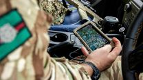 A soldier from 2 Yorks uses the new Dismounted Situational Awareness (DSA) to provide surveillance and coordinate ground troops with the feed from the drone pilot outside the vehicle (Picture: MOD).