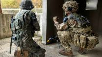 A soldier from C Company, the 1st Battalion Scots Guards talking a Republic of Korea soldier through the Arcs of fire during the Defensive phase on Exercise IMJIN WARRIOR (Picture: MOD).