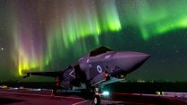 F-35B lightning jets on the flight deck of Prince of Wales under Aurora Borealis (Picture: MOD).