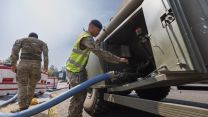 Soldiers from 10 Queen's Own Gurkha Logistic Regiment (10 QOGLR) assisting with filling up water bowsers and Mobile water reservoirs with water from local Welsh farmers and the Wales Fire Service using Military Close Support Tankers Pic MOD