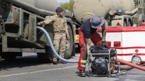 Soldiers from 10 Queen's Own Gurkha Logistic Regiment (10 QOGLR) assisting with filling up water bowsers and Mobile water reservoirs with water from local Welsh farmers and the Wales Fire Service using Military Close Support Tankers (Picture: MOD)