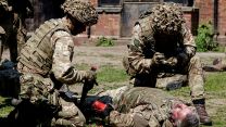 British Soldiers teaching first aid lessons during Operation Interflex (Picture: MOD Crown Copyright).