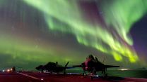 F-35B lightning jets on the flight deck of Prince of Wales under Aurora Borealis (Picture: MOD).