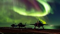 F-35B lightning jets on the flight deck of Prince of Wales under Aurora Borealis (Picture: MOD).
