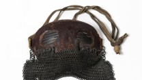 A British tank visor. They were worn for protection against the chips of hot metal flying in the interior of the tank as a result of hits on the outside.